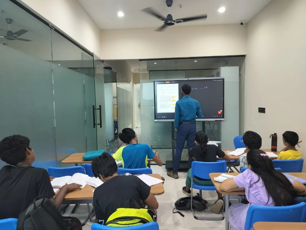 Smart classroom tuition session at Catalyst Classes Hyderabad with an interactive board and students learning in a modern classroom.